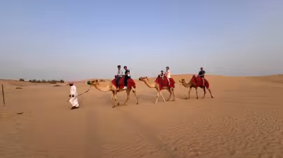 Camel ride in desert